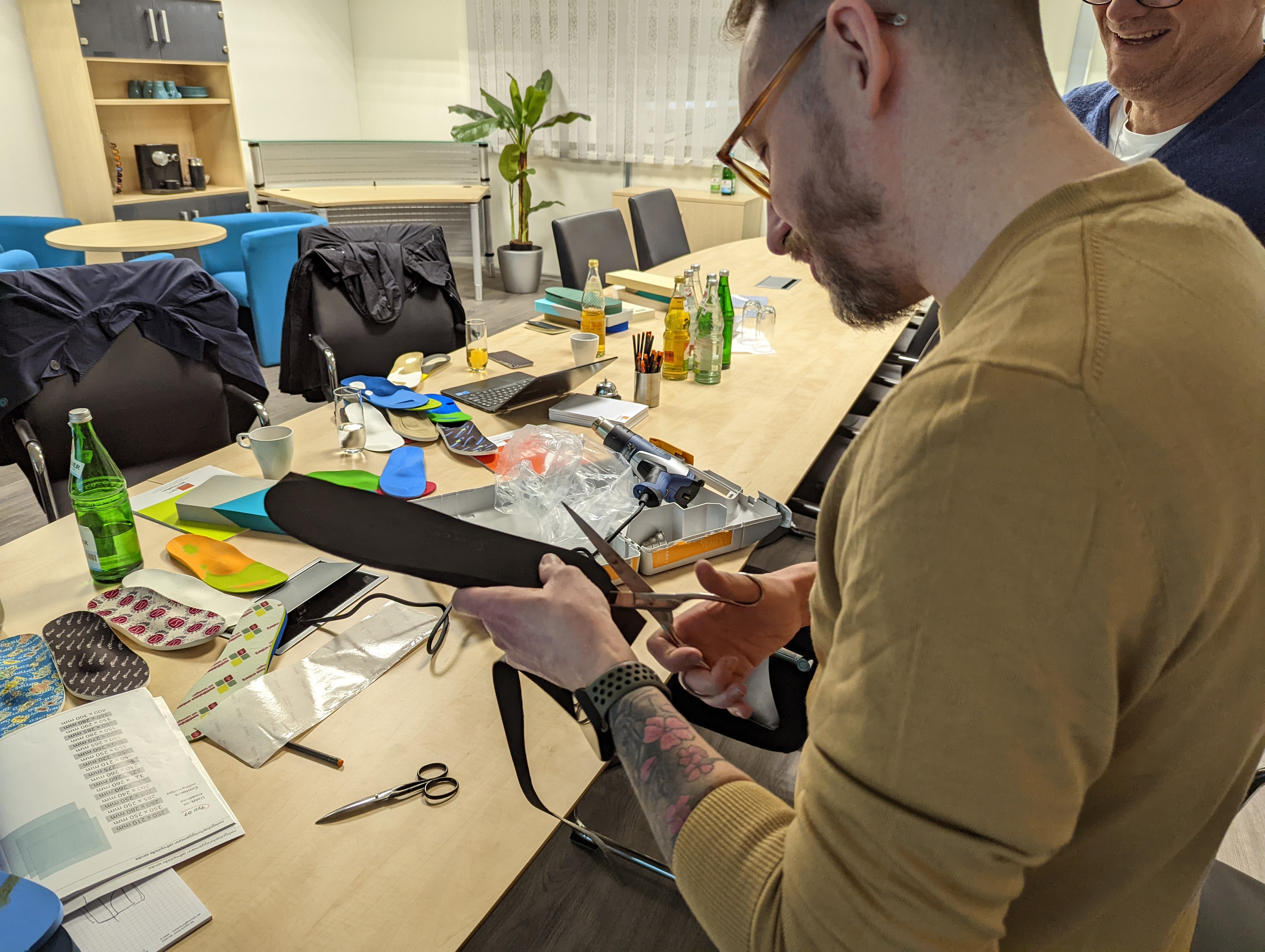 Technician finishing insole top cover